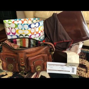 Coach full grain leather bag with brass hardware.